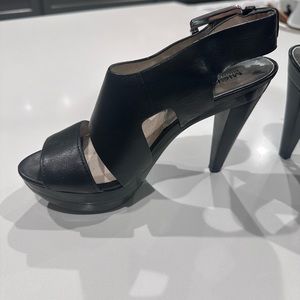 Women’s black leather Michael Kors heels with silver buckle. Worn twice.